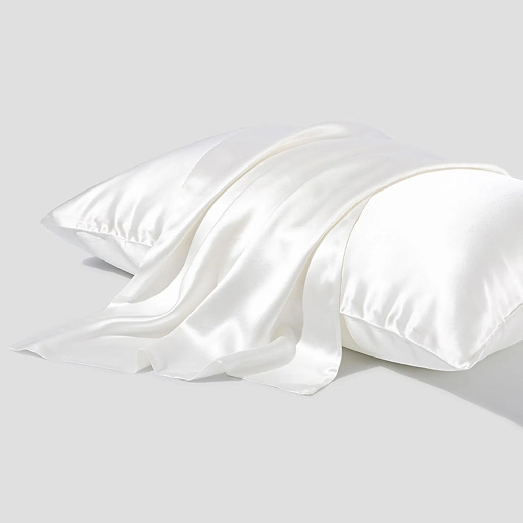 Dark grey 19 momme mulberry silk pillowcase with an envelope closure, laid flat.