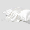 Dark grey 19 momme mulberry silk pillowcase with an envelope closure, laid flat.
