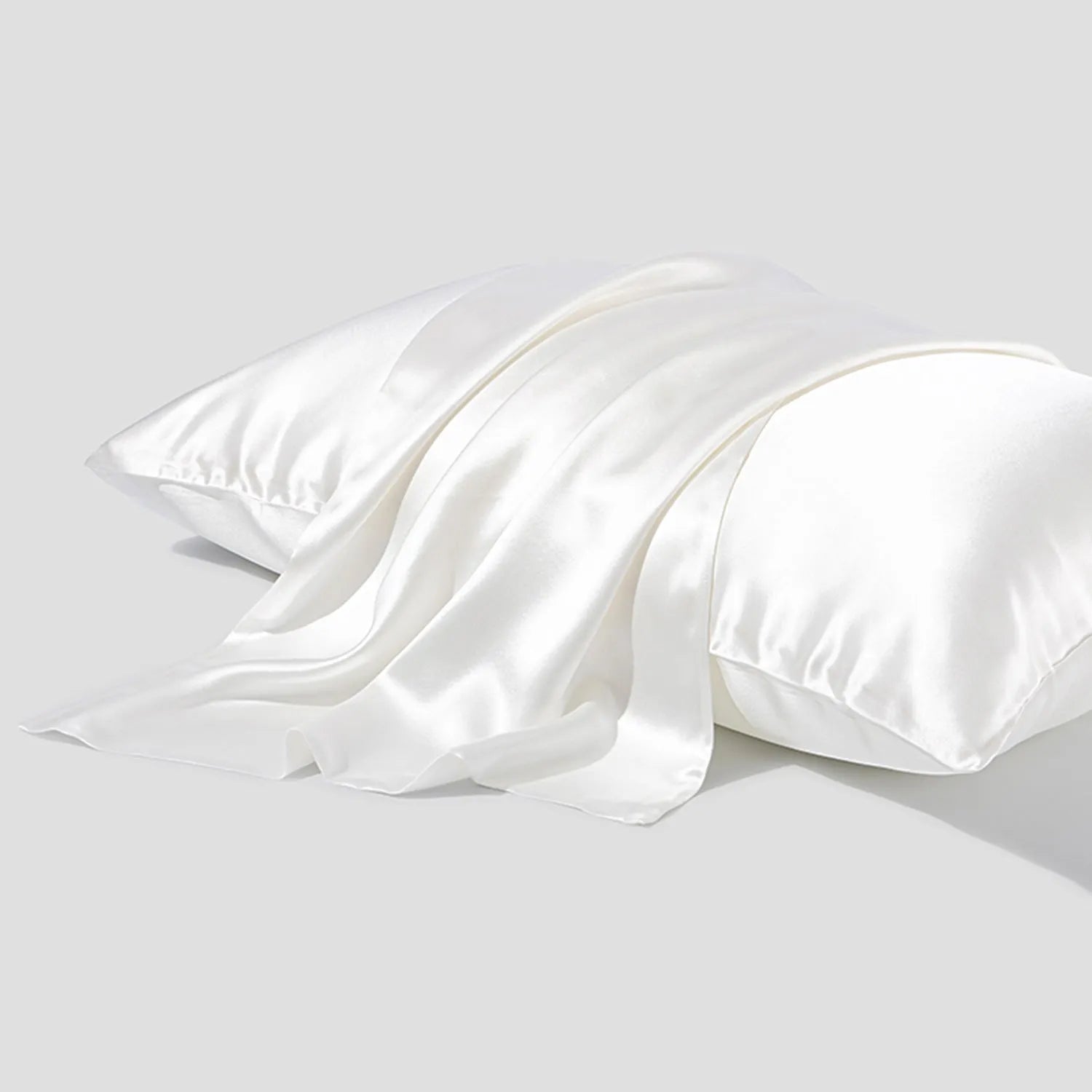 Dark grey 19 momme mulberry silk pillowcase with an envelope closure, laid flat.