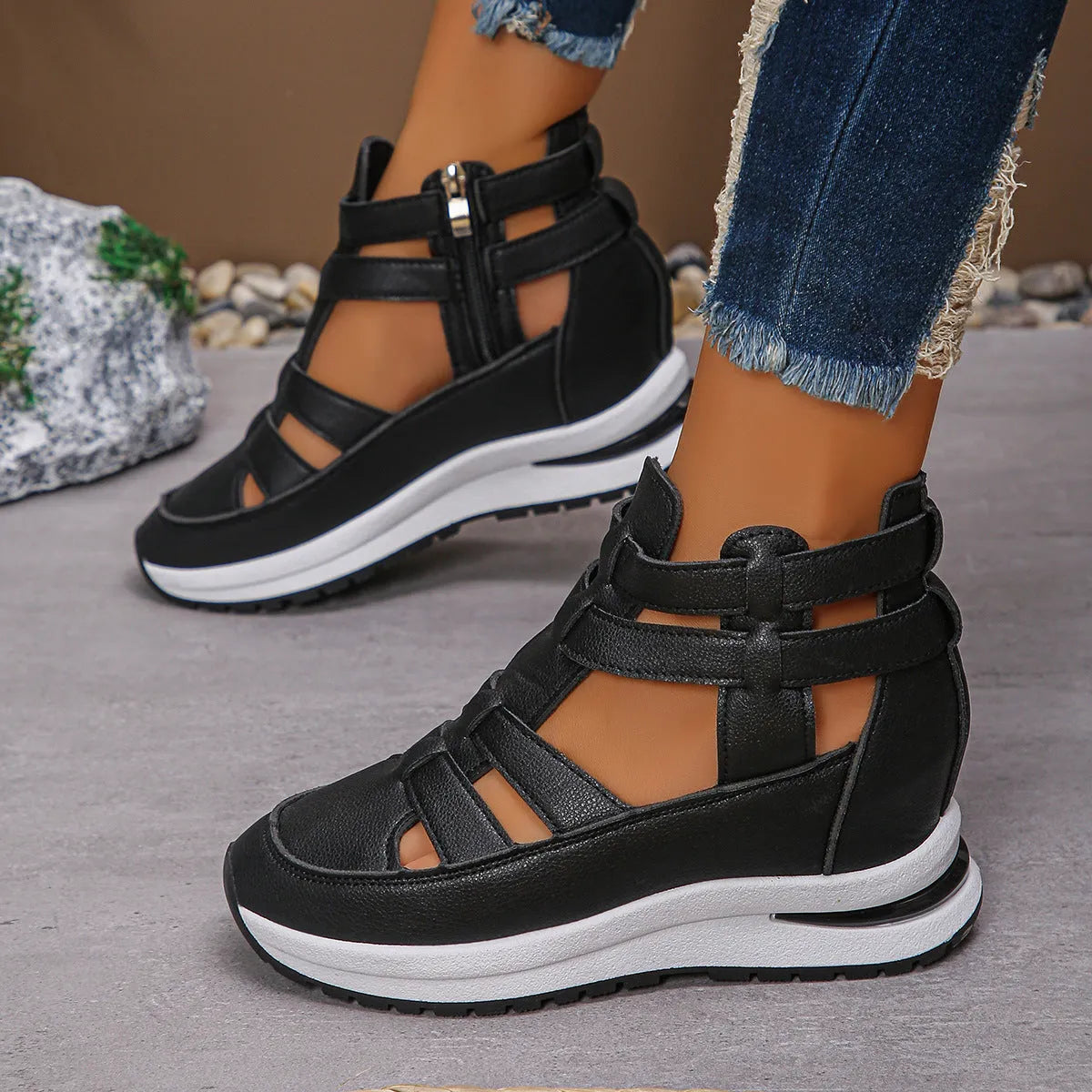 Women's black platform sandals with hollow-out design and Velcro strap.