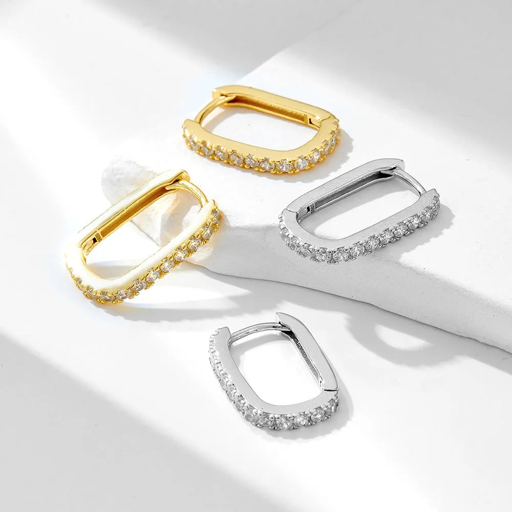 Sterling silver oval zircon ear clip earrings in geometric design