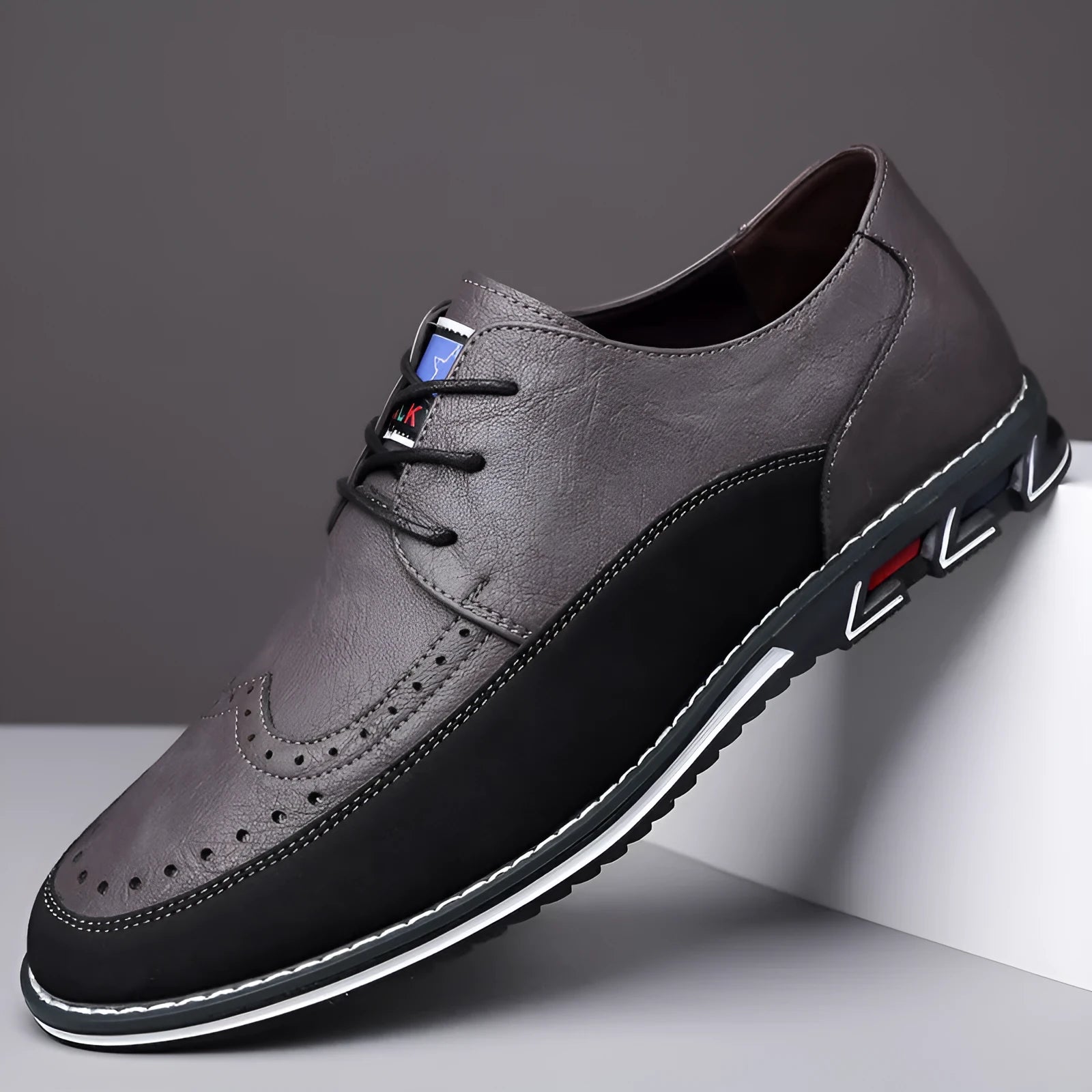 Men's casual leather shoes in black with rubber sole, leather toe cap, and stitching detail.