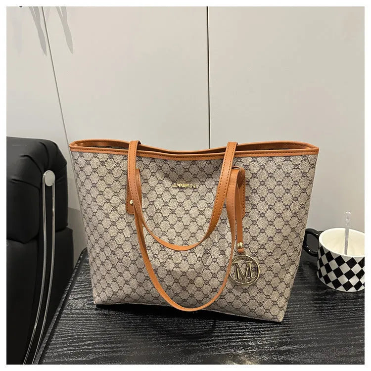 PU leather street trend shoulder bag with sewing thread detail in a choice of colours.