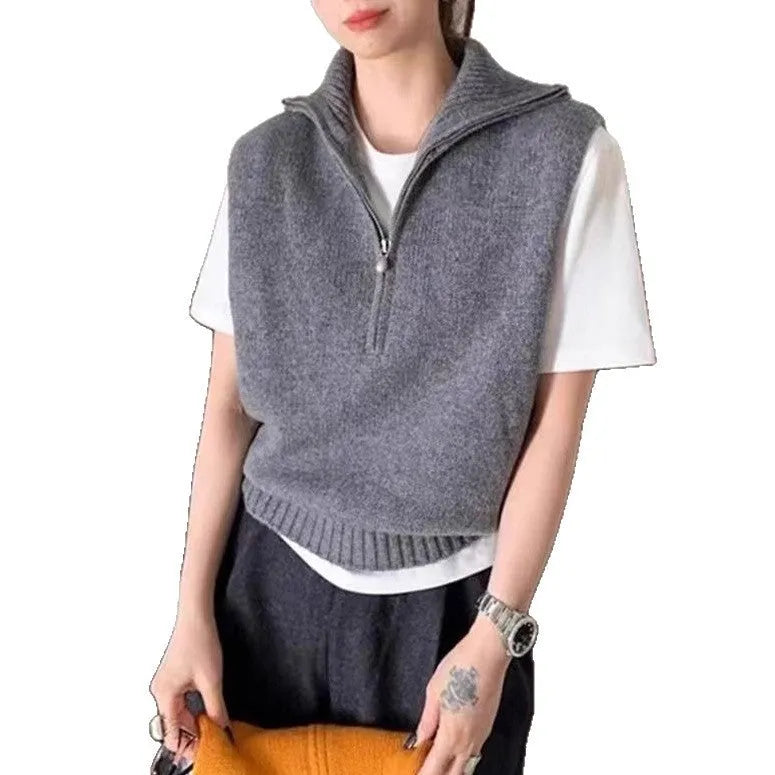 Retro half-zip sleeveless knit vest in solid colour polyester mesh fabric on a hanger.