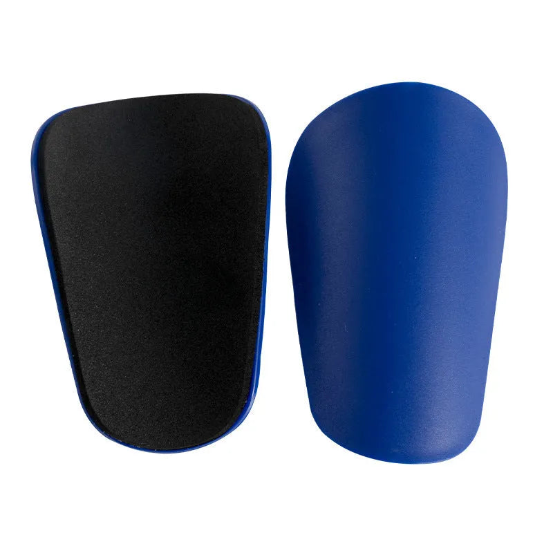PU mini shin guards for football and sports protection in black, white, red, and blue colours.