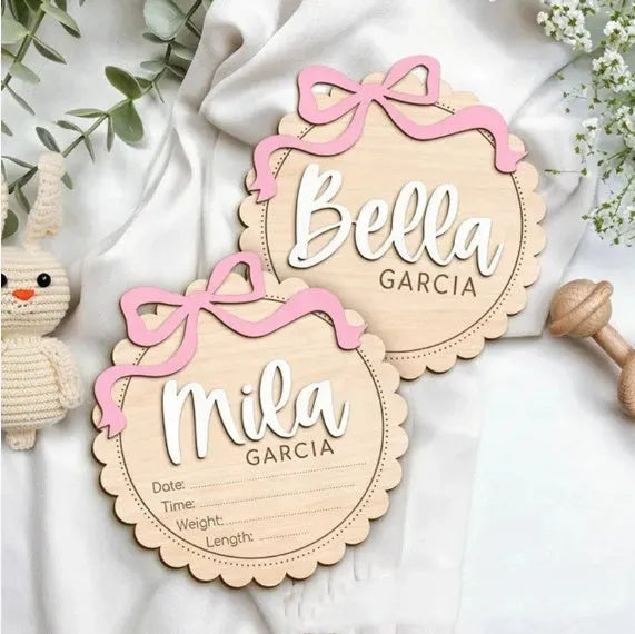 Square wooden baby room ornament with a custom engraved name, shown in two size options.
