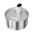 Stainless steel pet water fountain with heated base on countertop