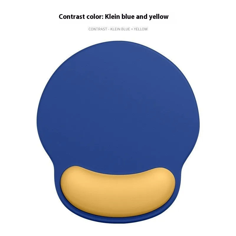 Silicone mouse mat with wrist rest in gradient colour pattern on desk