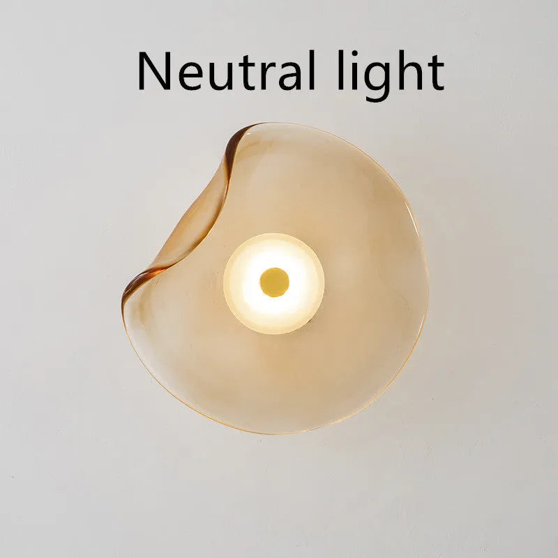 Round glass wall lamp in cognac colour with diffused lighting for bedroom bedside decoration
