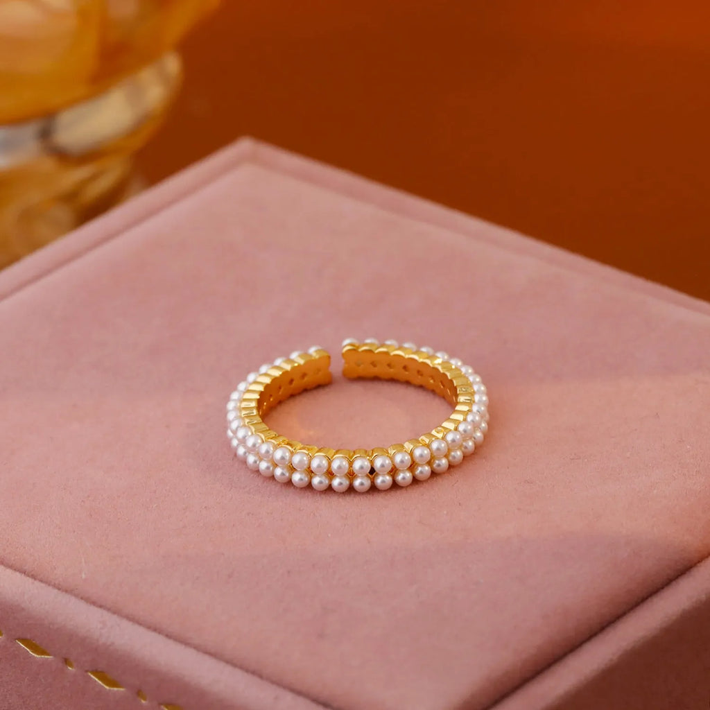 Gold geometric open-mouth women's ring with circular design elements on copper with electroplated finish