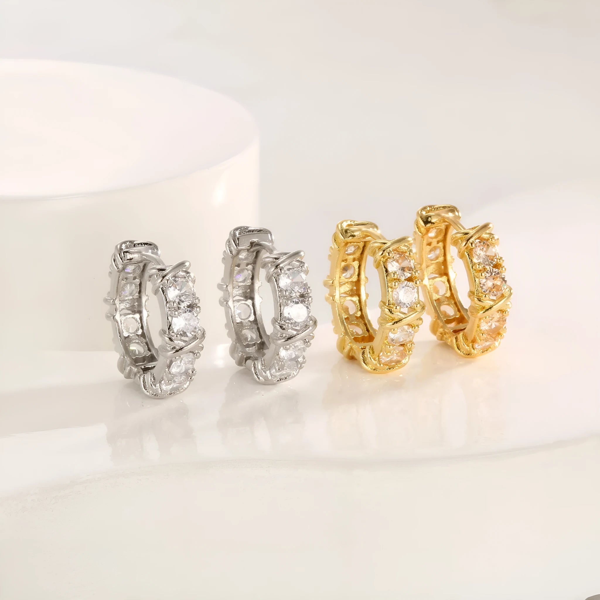 Geometric hexagonal clover cross earrings in silver or gold colour with electroplated finish and ellipse design details