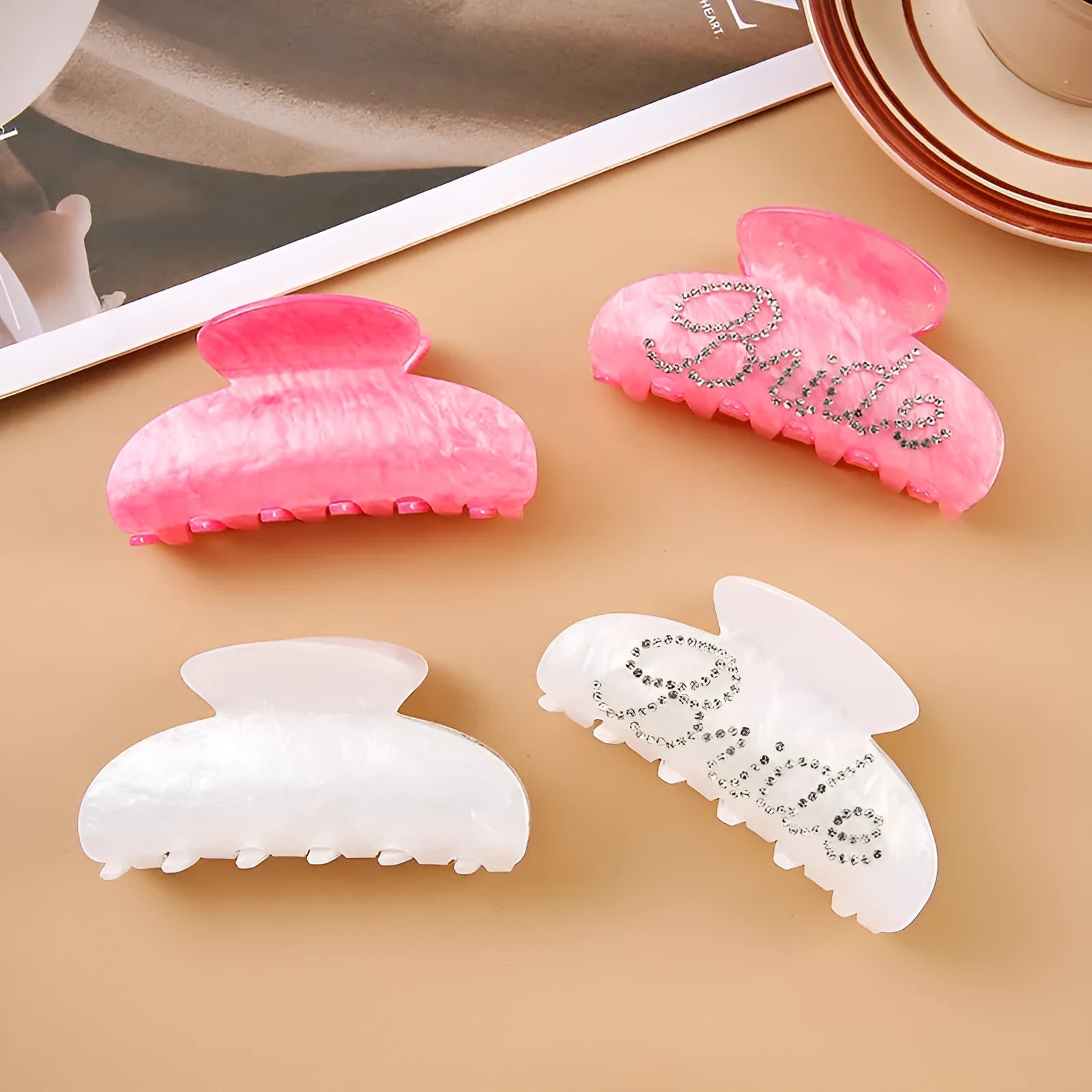 Pink and white acrylic barrette hair clip with diamond spot drilling and English letters.