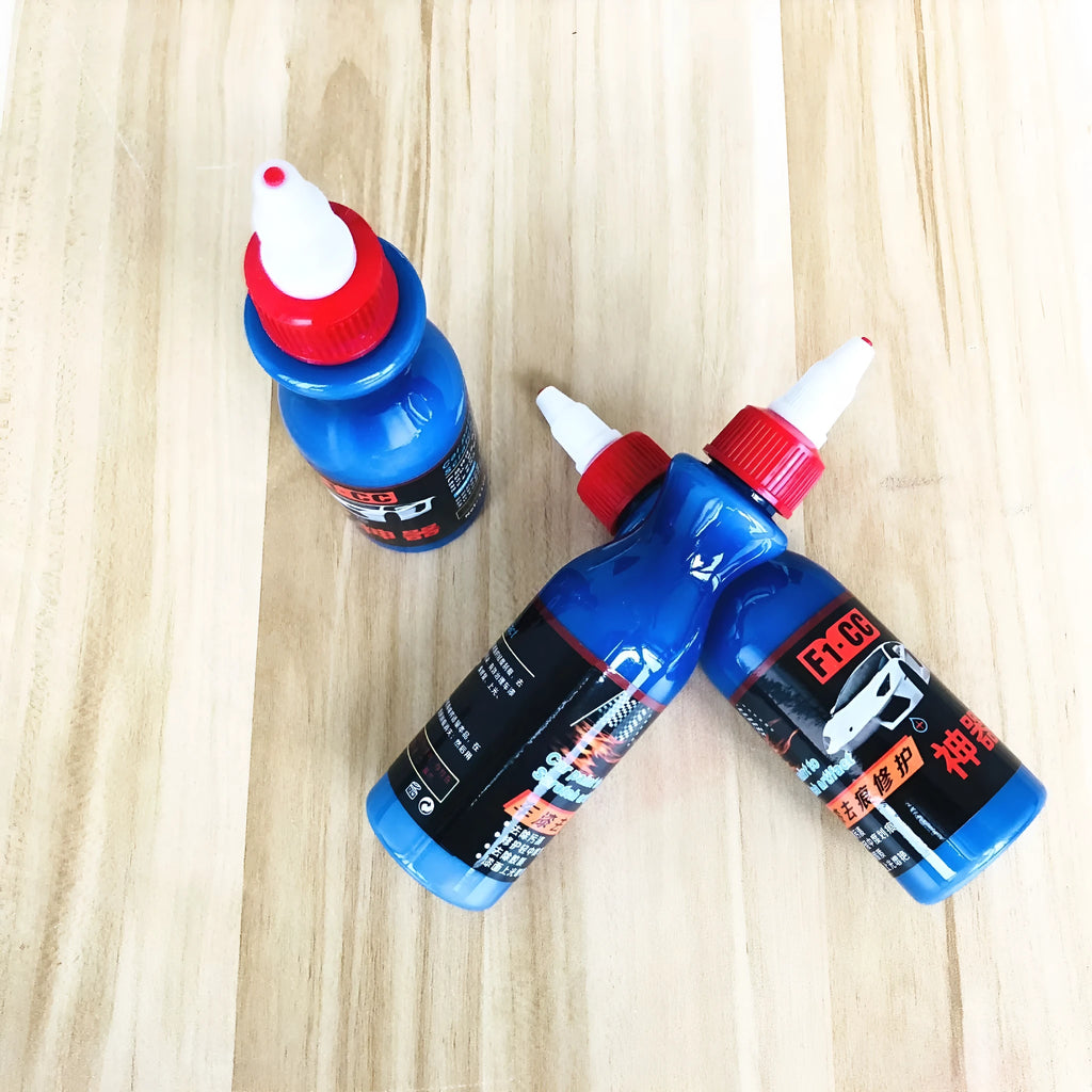 Small blue car wiping tool kit with scratch repair agent bottle and applicator sponge.