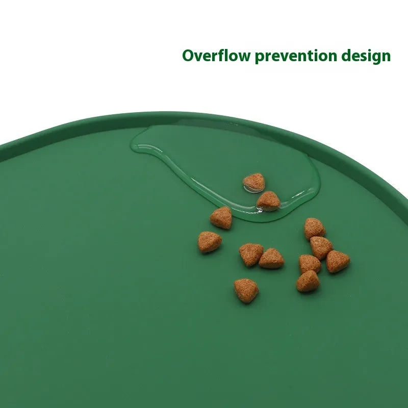 Green silicone waterproof pet feeding placemat with a food bowl on it.
