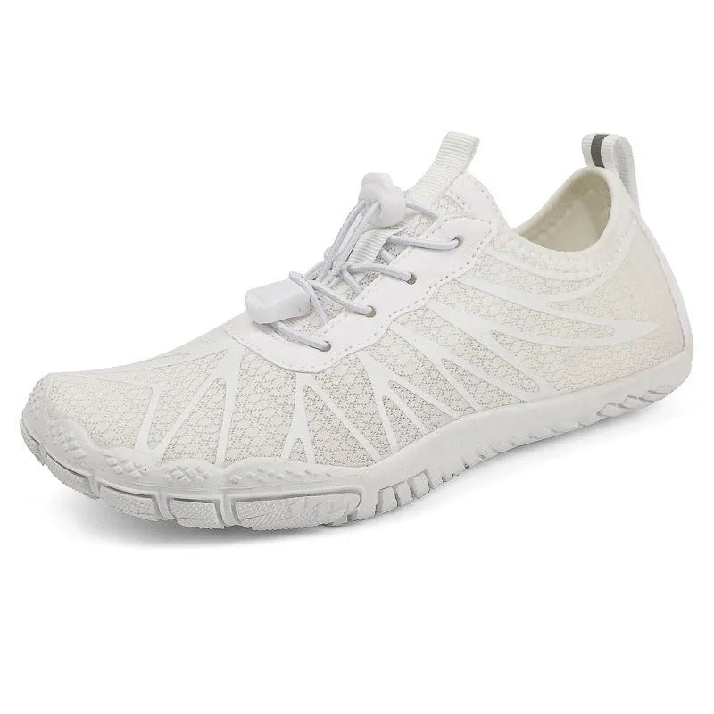 Low-top unisex casual sports running shoe in multiple colours with a lace-up front and rubber sole.