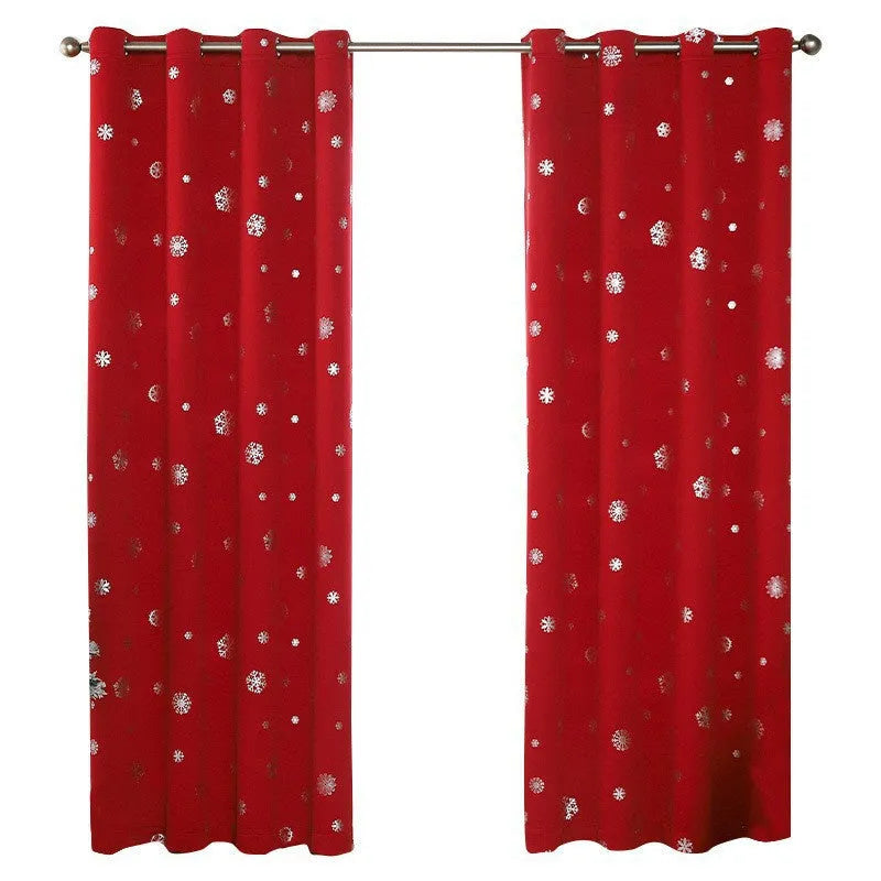 Red polyester snowflake pattern shade cloth curtain with lace loop trim hanging on a window