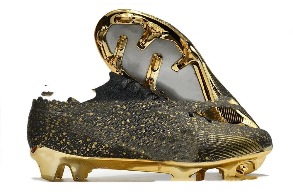 Men's black football shoes with FG studs, knitted upper, and lace-up closure on grass pitch
