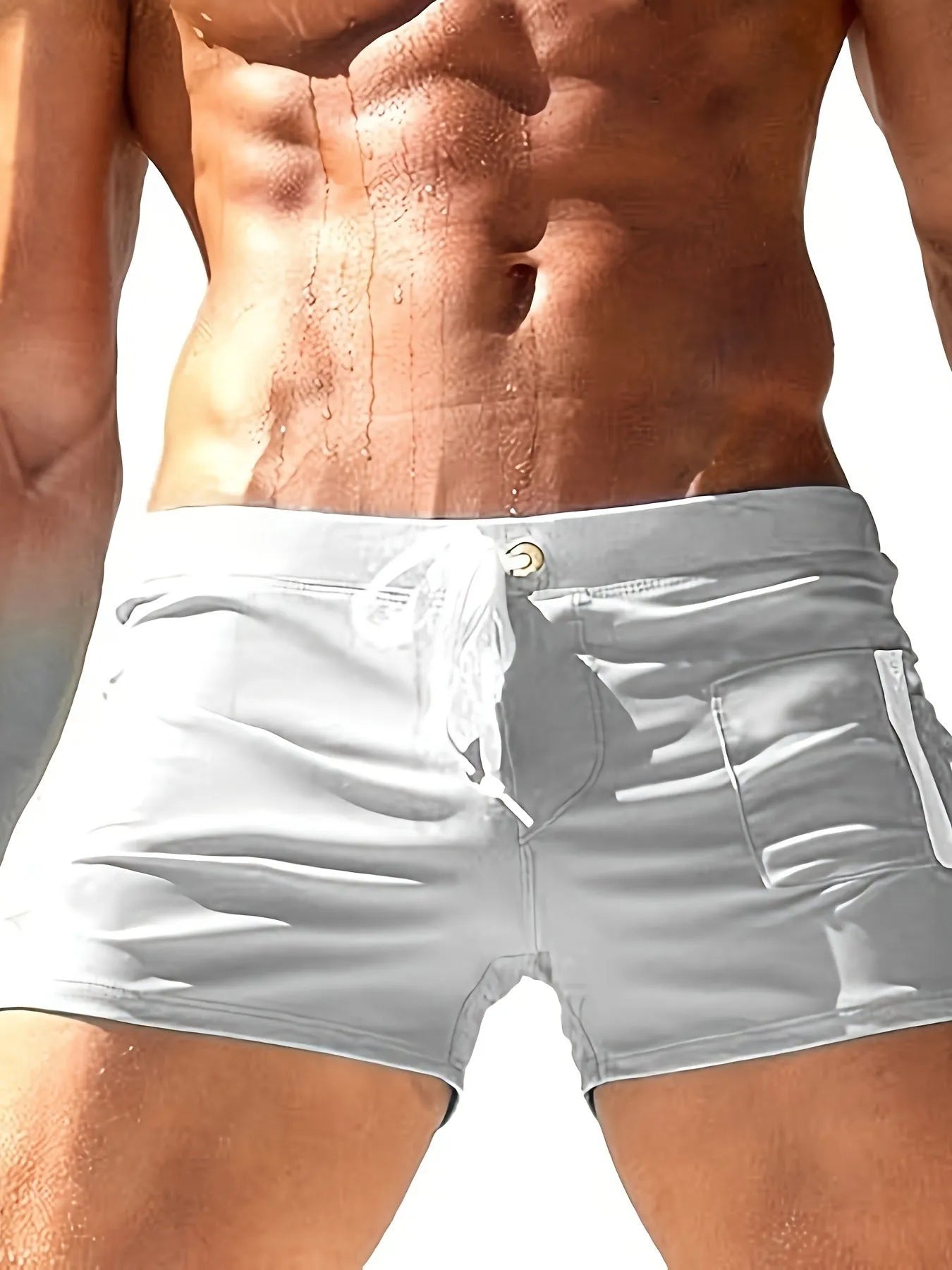 Men's black high-waist polyester swimming trunks with lace-up detail and spandex lining
