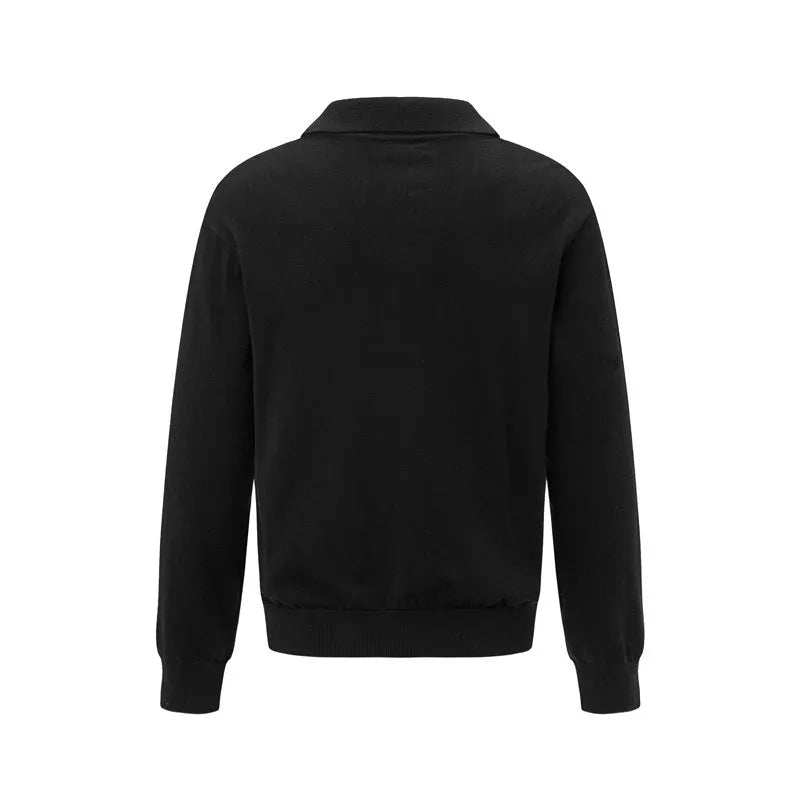 Man wearing a loose black acrylic blend pullover bottoming shirt for casual leisure wear.