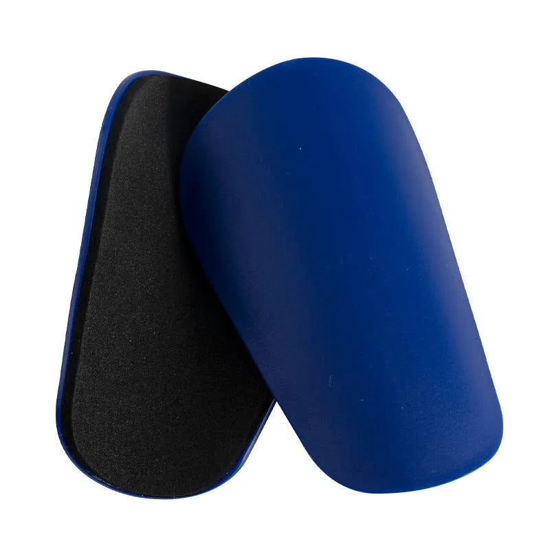 PU mini shin guards for football and sports protection in black, white, red, and blue colours.