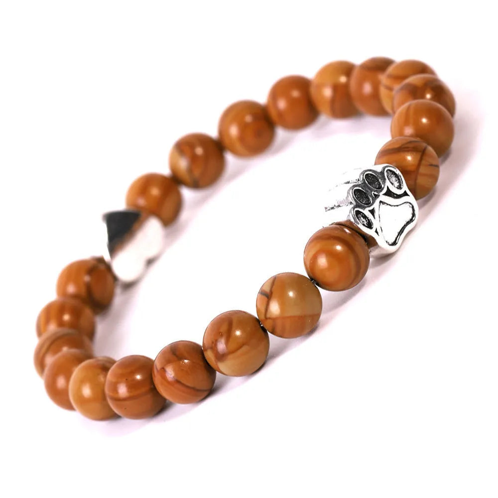 Tigereye Indian Agate stone beaded dog's paw bracelet on wrist, showing geometry shape and round beads.