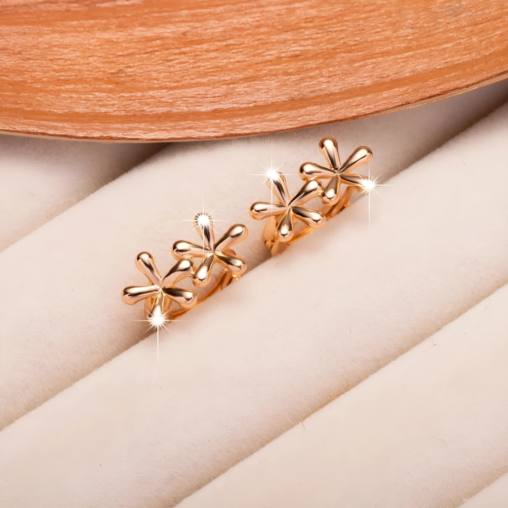 Circular rose gold earrings with a waterdrop flower design for women.