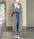 Women's loose fit knitted cardigan in khaki with V-neck and long sleeves.