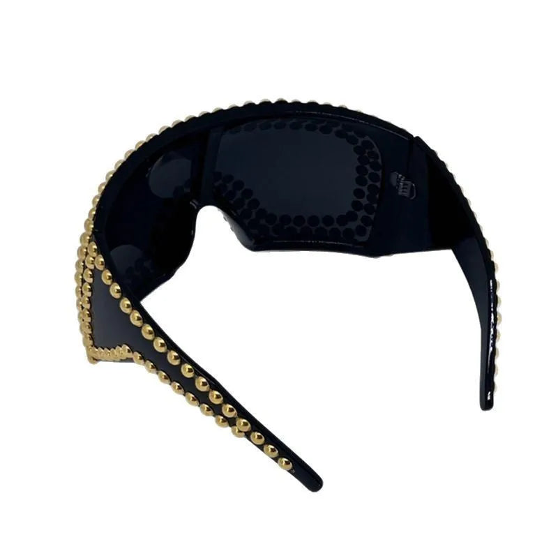 Men's punk style sunglasses with super large square rim and rivet details in gold colour