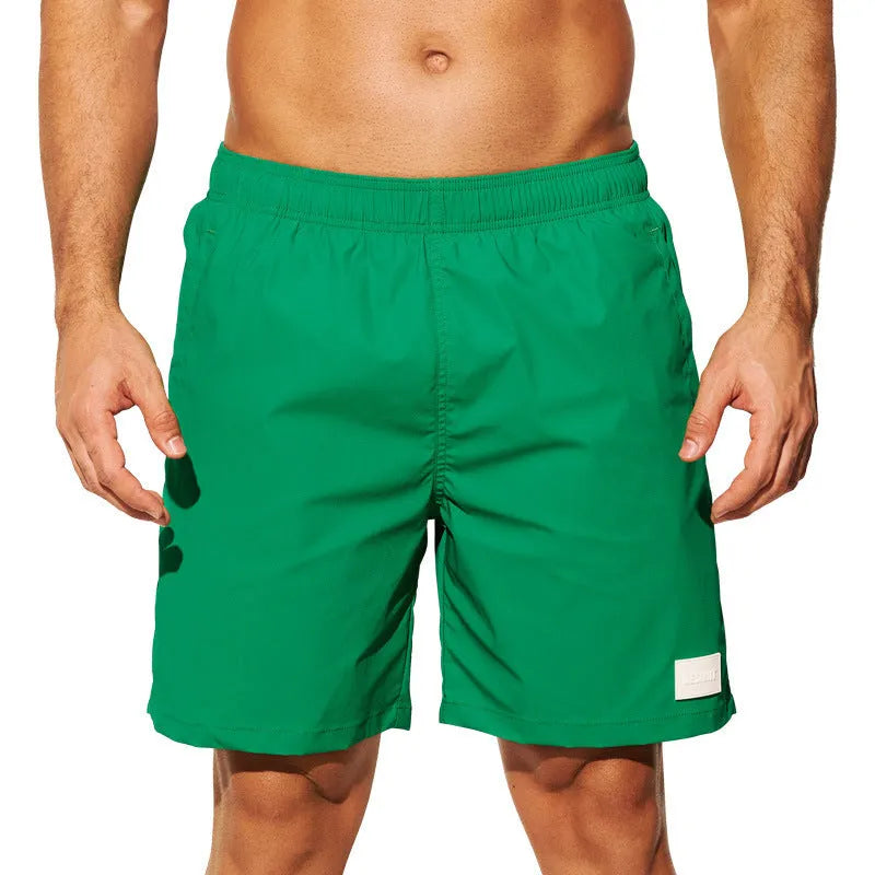 Men's quick-dry nylon sports shorts in solid colours with straight leg design