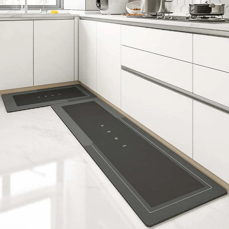 Soft blue oval bathroom floor mat placed on tiles beside a bathtub.