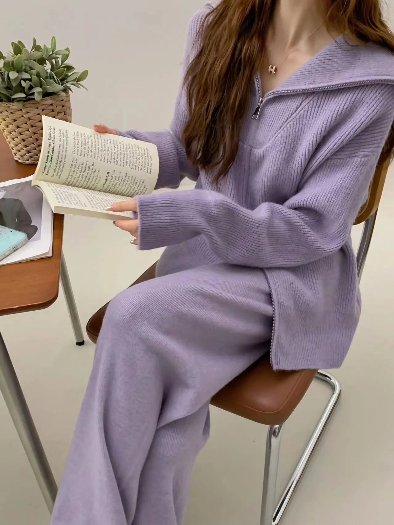 Women's solid colour polyester two-piece set featuring a knitted zipper cardigan and wide leg trousers.