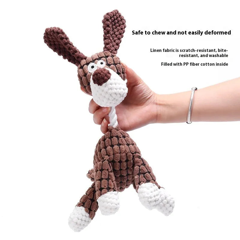 Assorted plush pet chew toys including a blue elephant, a duck, and a donkey in different colours