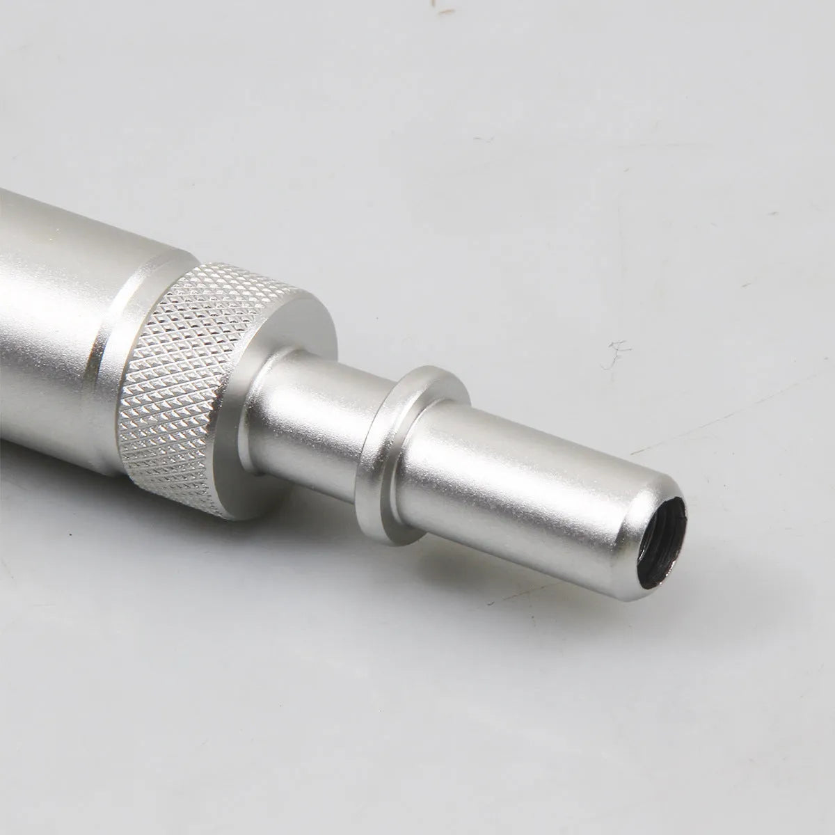 Silver metal transmission refuelling joint adapter tool for automotive gearbox oil changes