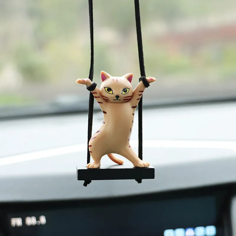 Cartoon style resin cat pendant on a rope for hanging in a car, shown in multiple colour options.