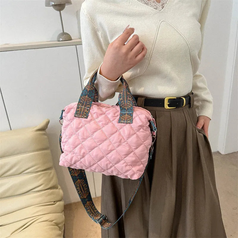 Soft Oxford cloth messenger bag with embroidery details and internal phone pocket in horizontal square shape