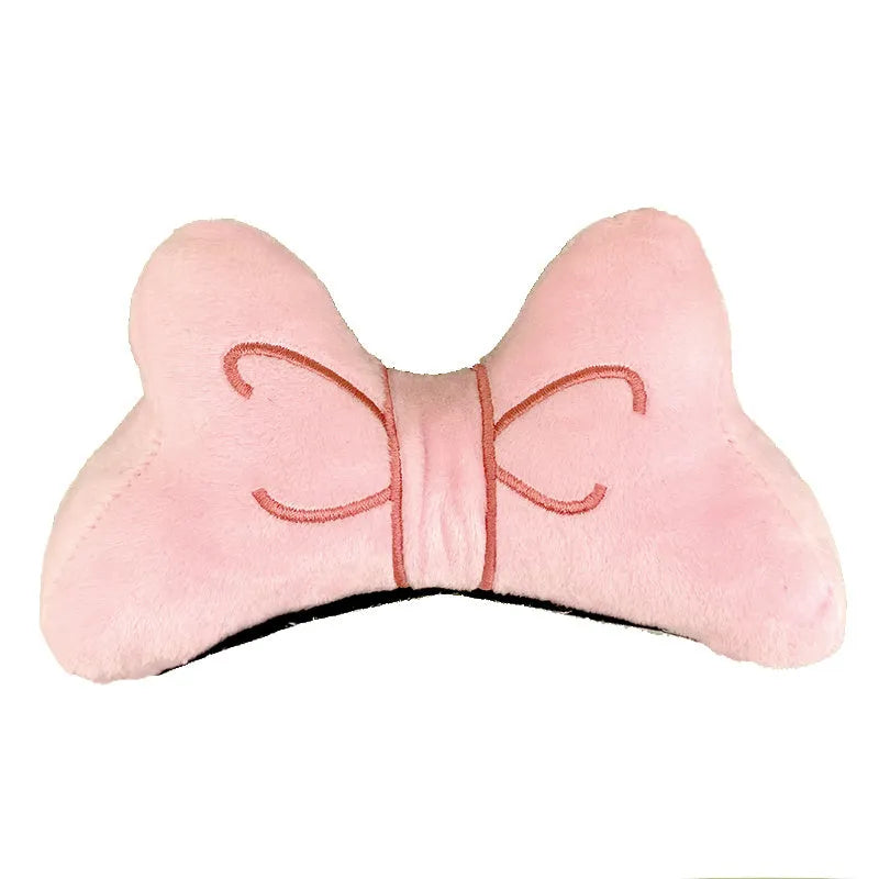 Plush bow tie helmet decoration for motorcycle and ski helmets in red, peach pink, and rose pink colours.