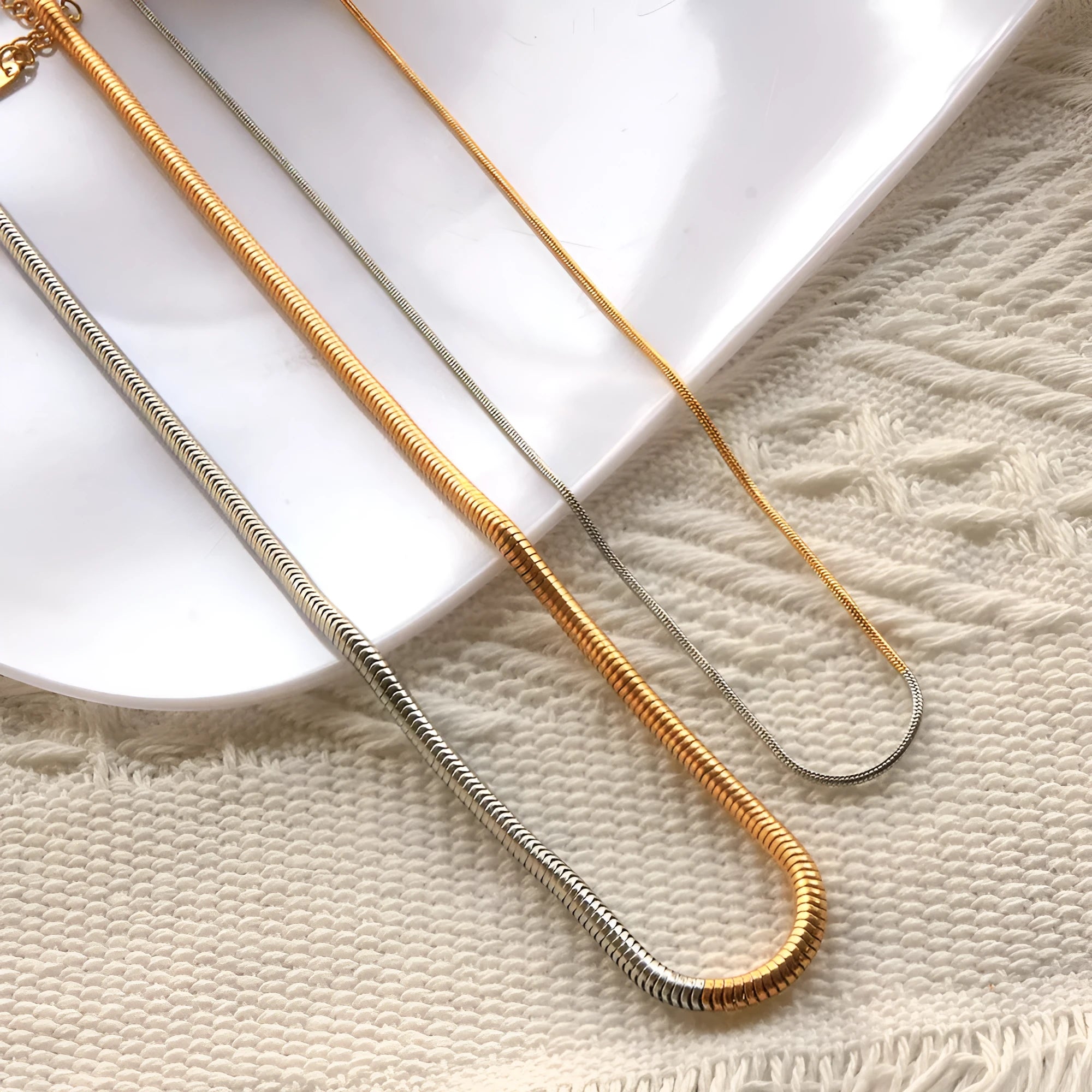 Golden stainless steel snake bone chain necklace with geometric line design