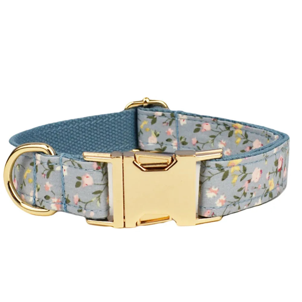 Blue floral pattern dog collar set with matching accessories including bow, leash and vest