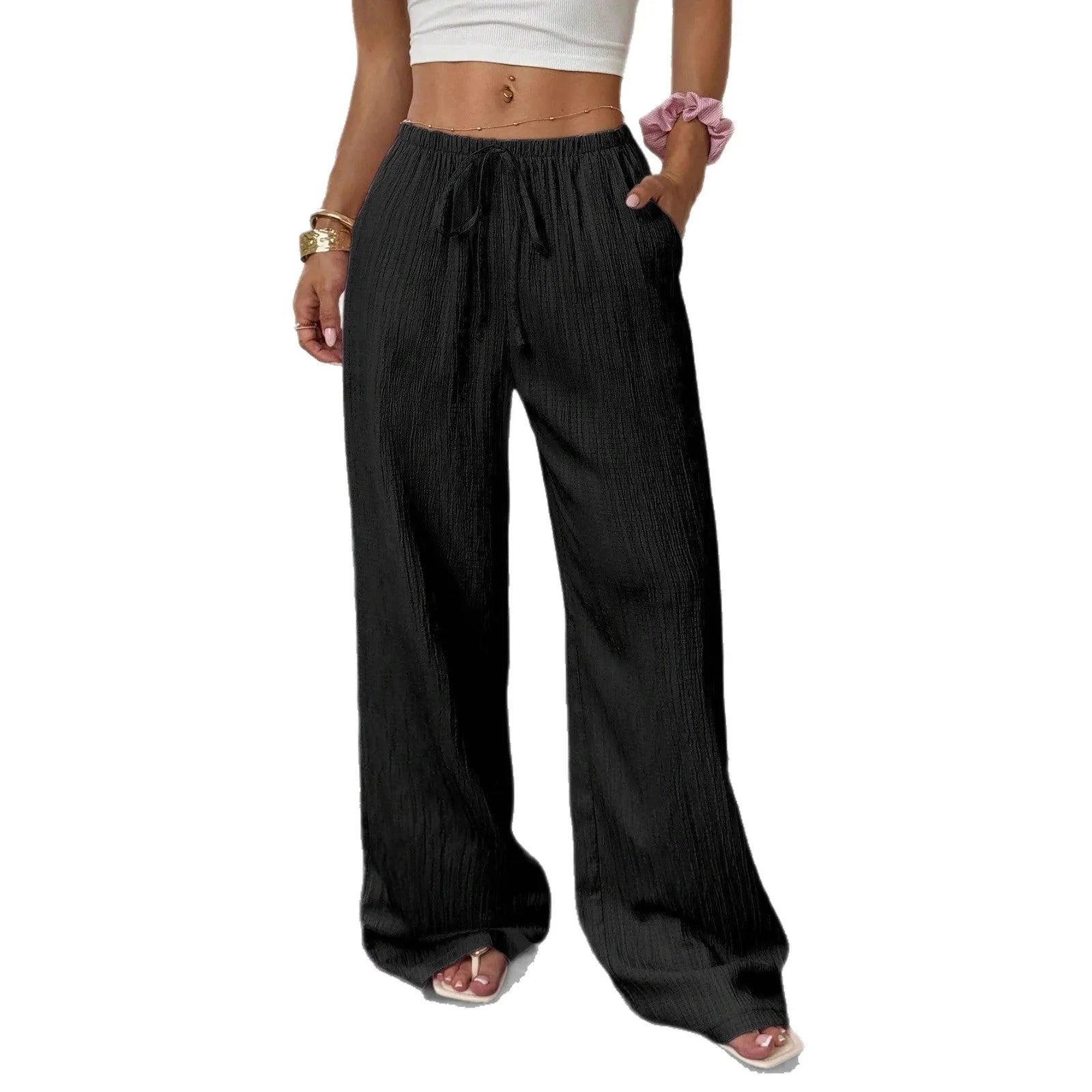 Women's black wide leg trousers with lace-up waist detail on hanger