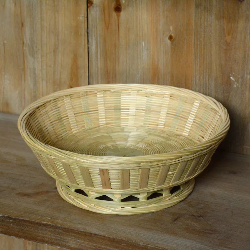 Handmade natural bamboo storage basket shown in one of three size options for household organisation.