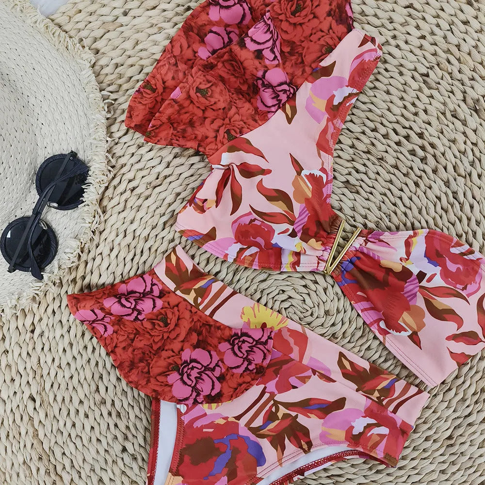 Pink floral print one-shoulder women's bikini swimsuit with high-waist briefs and ruffle trim