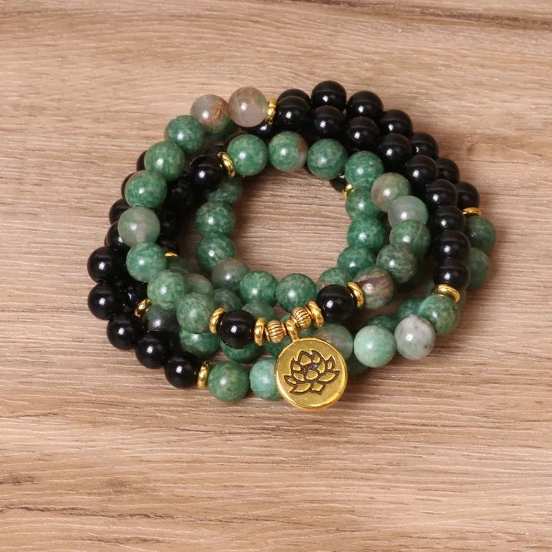 Green and black elastic beaded alloy bracelet with natural styling