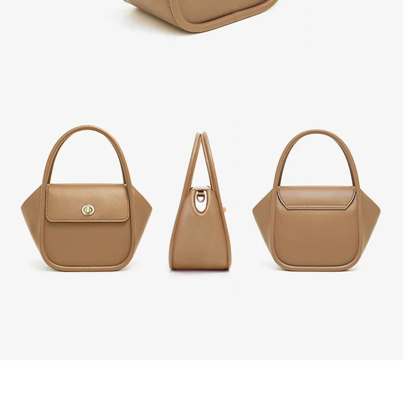Soft cow leather wing-shaped tote handbag with a buckle and cross-body strap in four colour options.