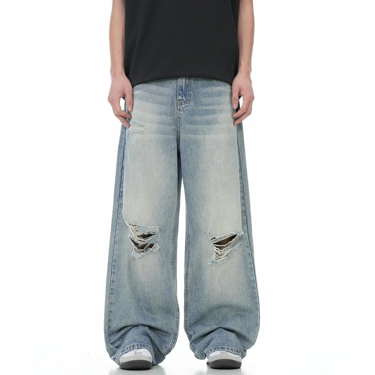 Blue wash straight-leg jeans with ripped detailing and zipper fly opening