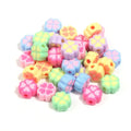 A pile of 15mm frosted acrylic four-leaf clover beads in mixed colours including pink, green, and blue.