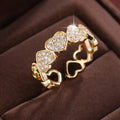 Geometric love heart couples ring with adjustable opening in gold and silver colours