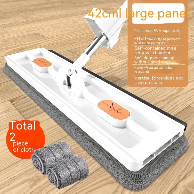 Large flat mop with long stainless steel handle and blue cleaning cloth on a hard floor.