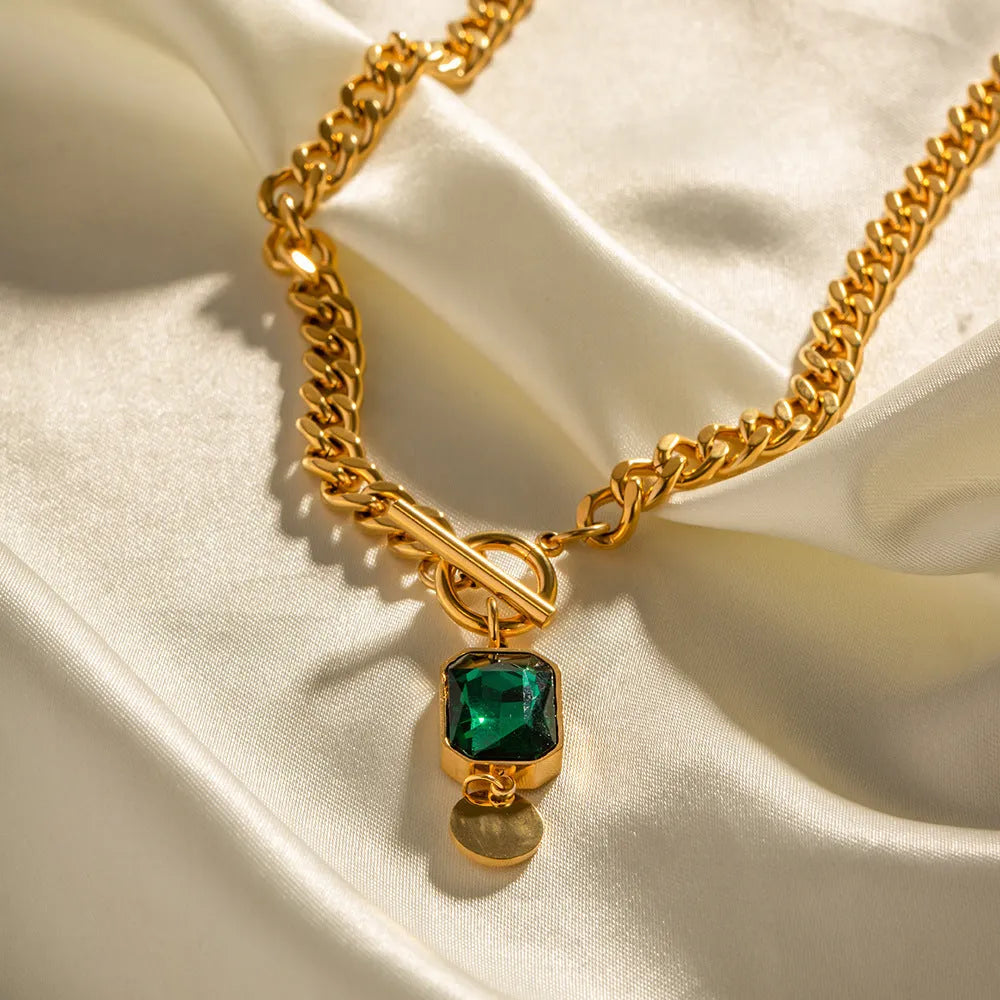 Gold geometric pendant necklace with emerald green zircon on titanium steel Cuban chain