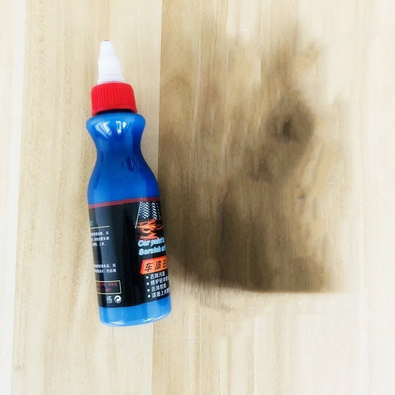 Small blue car wiping tool kit with scratch repair agent bottle and applicator sponge.