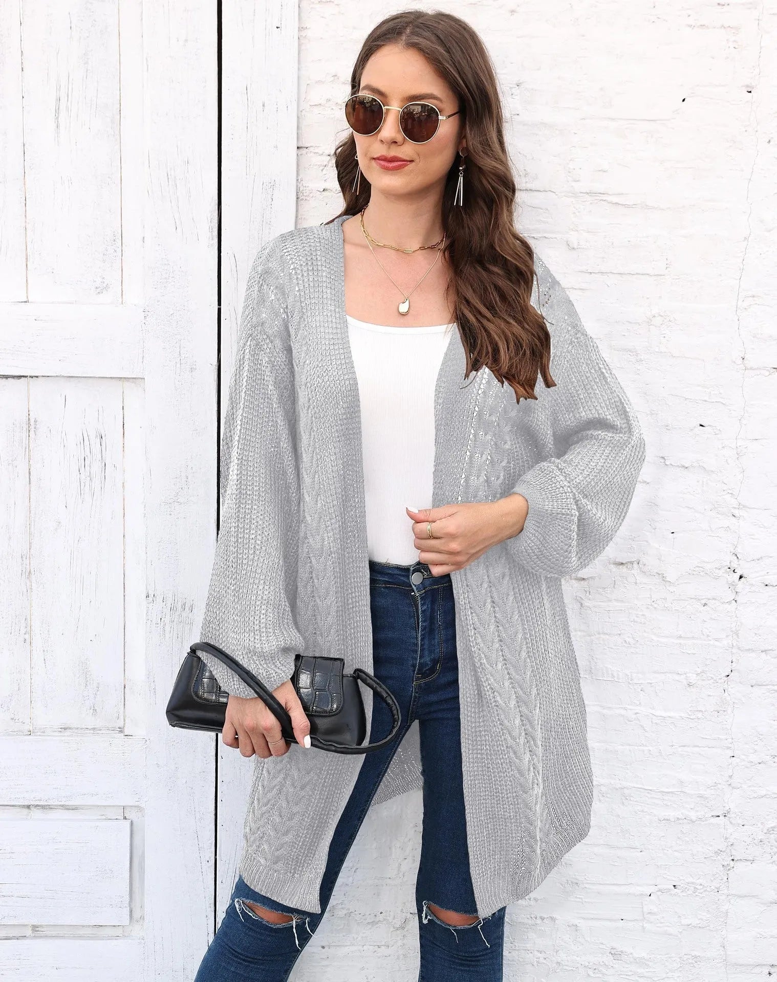 Women's loose fit acrylic sweater coat in army green, shown front on, casual style.